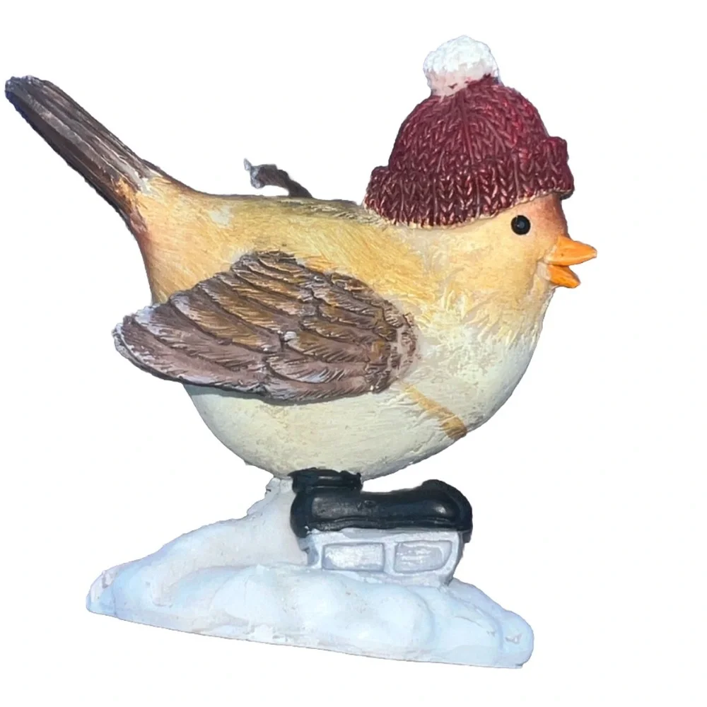 Adorable Small Bird figurine With Winter Hat And Ice Skates. In good condition.